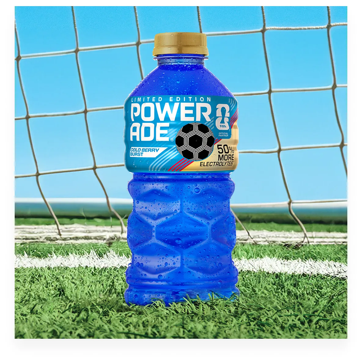 A bottle of Powerade Legacy Cold Berry Burst on a soccer field