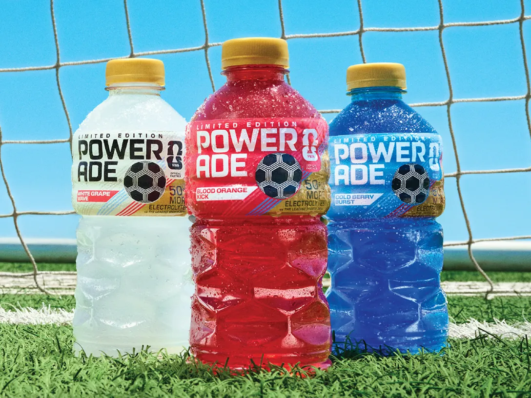 Three Powerade Legacy Lineup Drinks on a soccer field